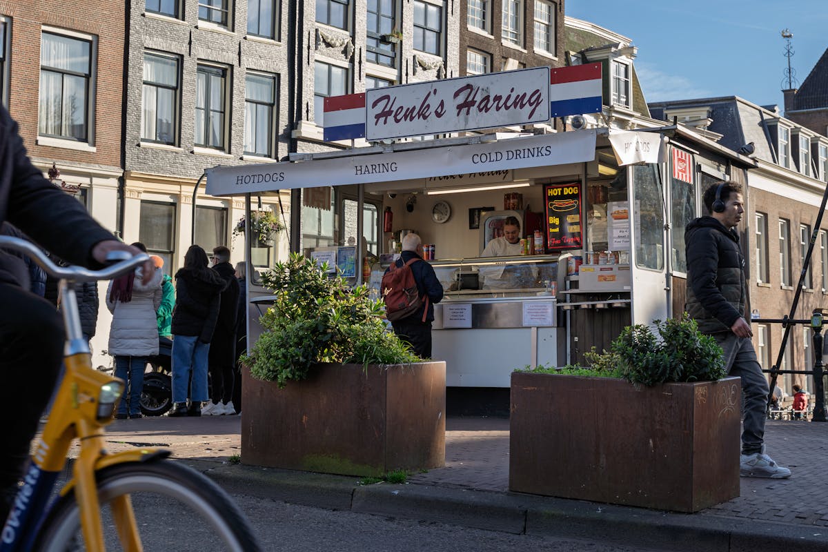 Food stall serving traditional Dutch herring in Amsterdam