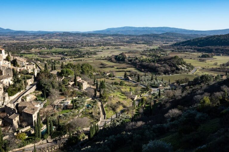 Aerial view of Gordes, a medieval hilltop village in Provence surrounded by countryside