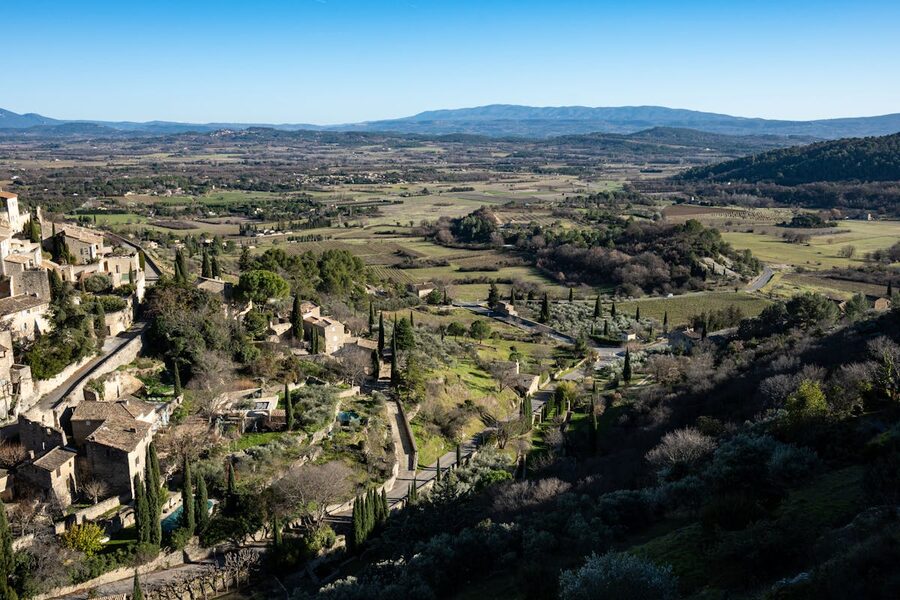 Aerial view of Gordes, a medieval hilltop village in Provence surrounded by countryside