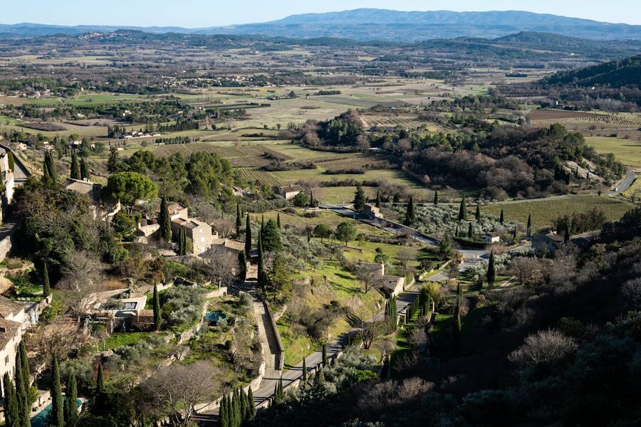 Aerial view of the Provence countryside near Gordes showing rolling hills and farmland