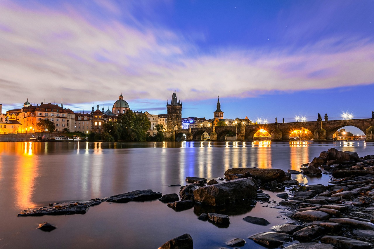Charles Bridge with Prague cityscape and cathedral at dawn