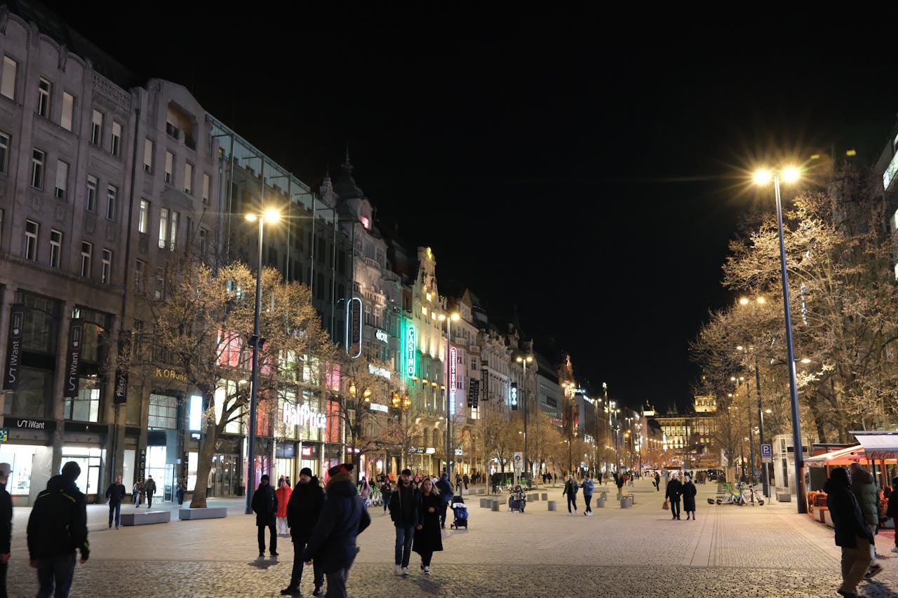 Night scene of Prague streets with warm city lights and historic architecture