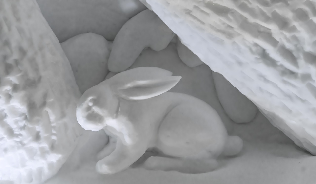 Detailed ice sculpture of a rabbit at an ice bar venue