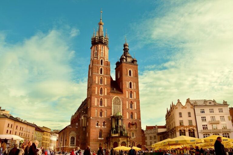 Main Market Square with St Marys Basilica towers in Krakow Poland