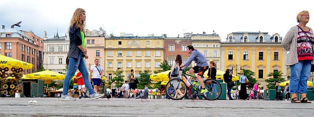 People and market stalls in Krakow main market square Poland