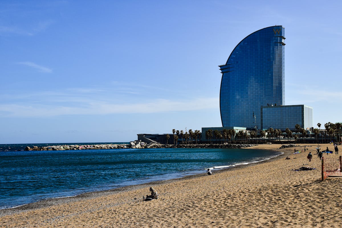 View of Barcelona beach with the iconic W Hotel and clear blue sky