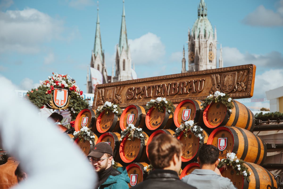 Oktoberfest festivities at the Spatenbrau tent in Munich with beer barrels and crowds
