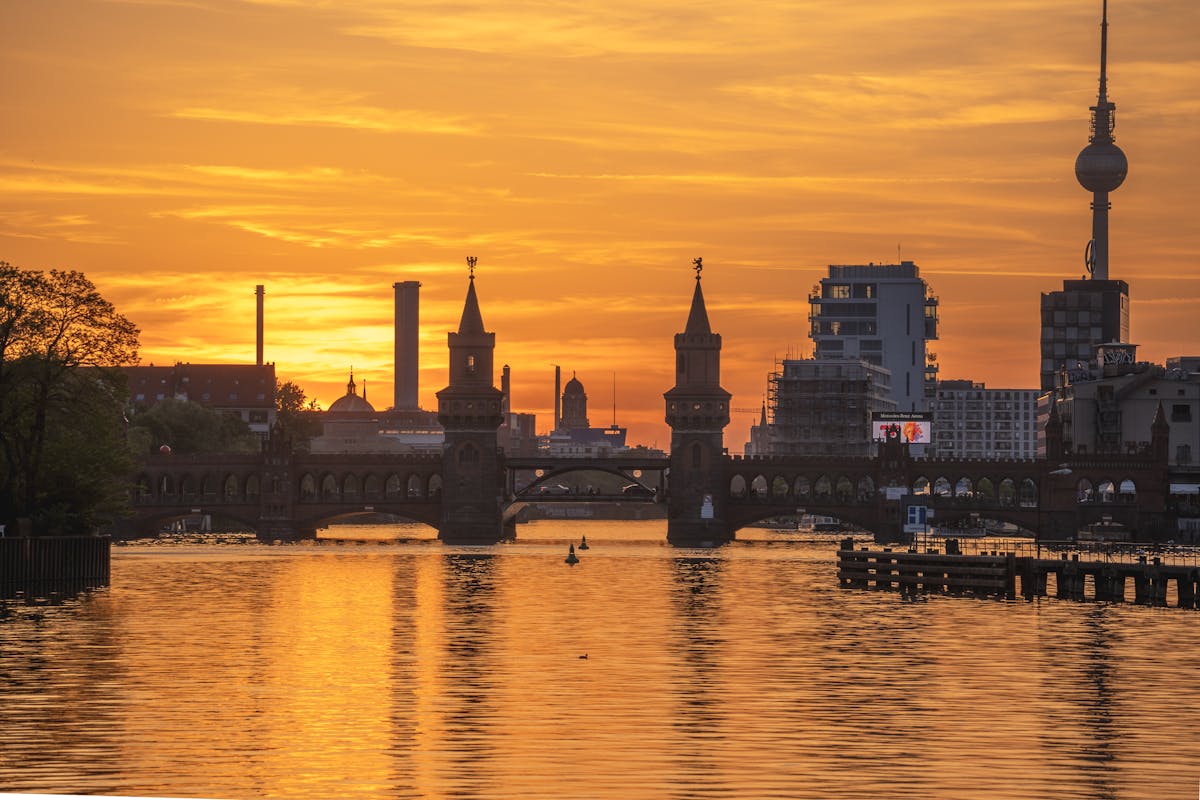 Oberbaum Bridge and TV Tower at sunset over the Spree River in Berlin