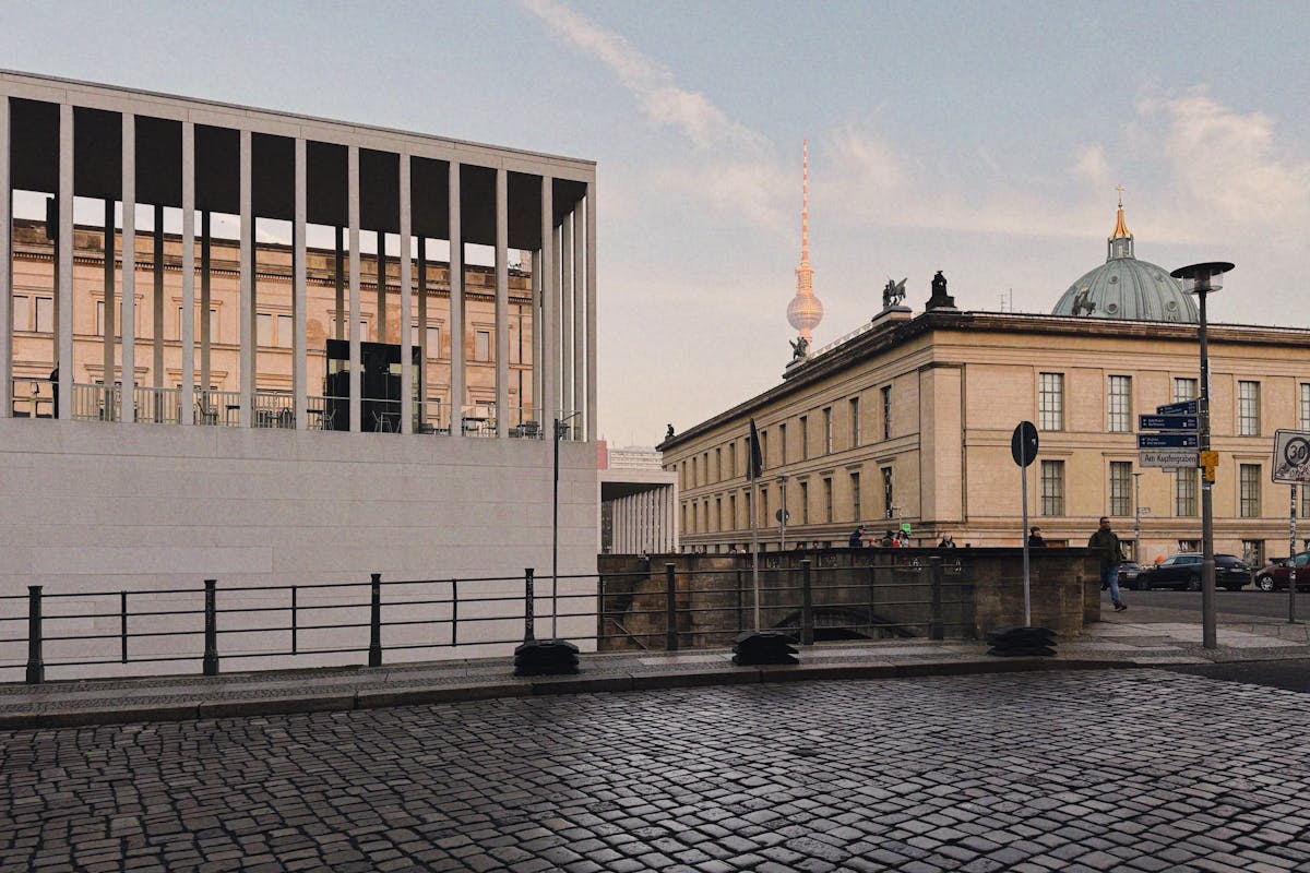 The Berlin Fernsehturm viewed through surrounding architecture in the city center