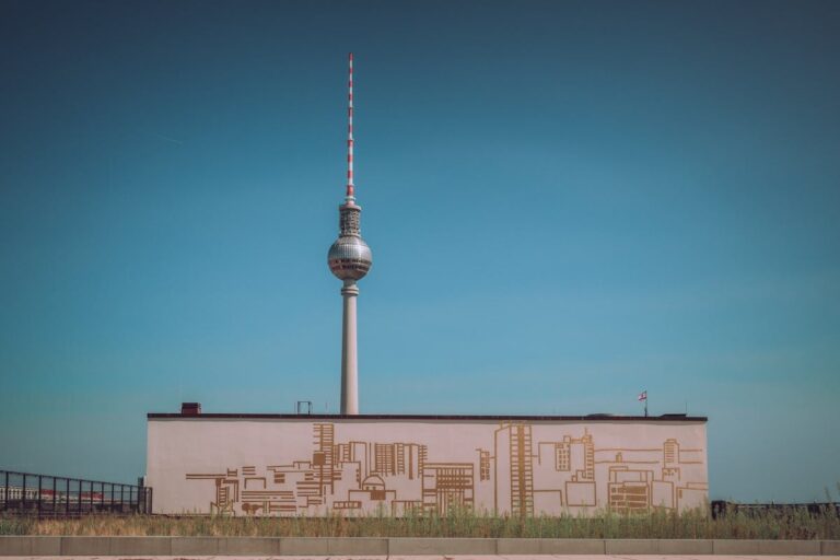 The Berlin TV Tower (Fernsehturm) rising into a clear blue sky above Alexanderplatz