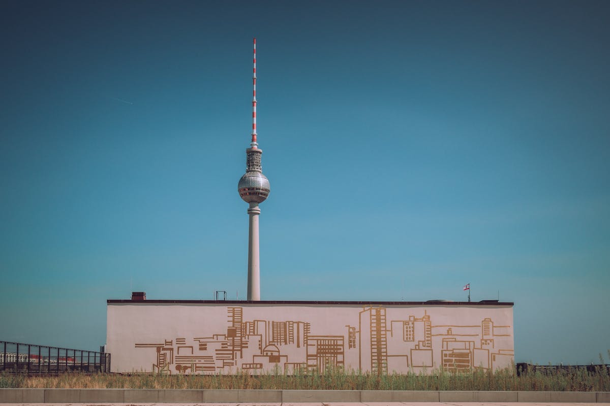 The Berlin TV Tower (Fernsehturm) rising into a clear blue sky above Alexanderplatz