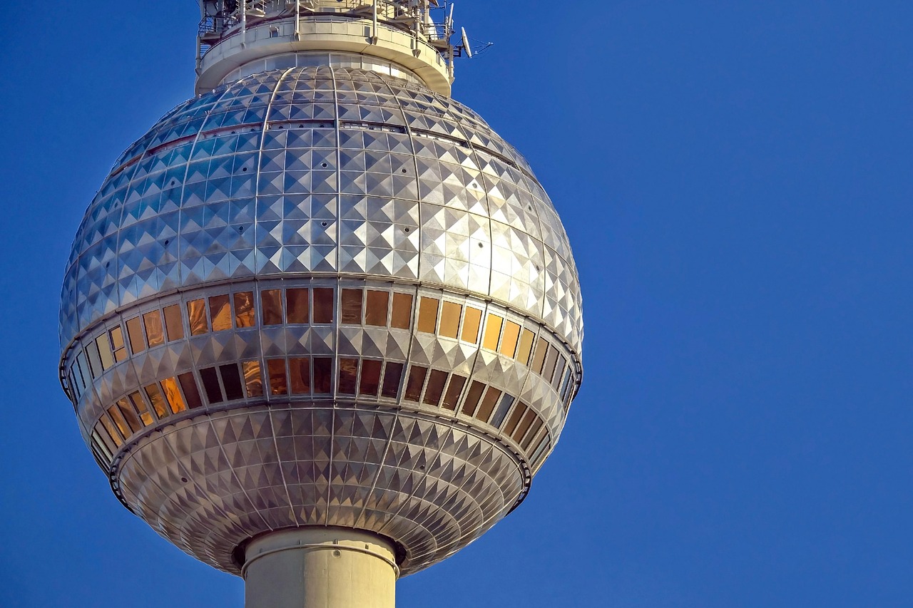 Looking straight up at the Berlin TV Tower from its base at Alexanderplatz