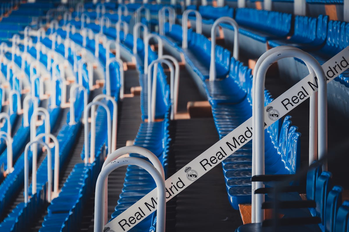 Rows of blue Real Madrid-branded seats at Santiago Bernabeu Stadium