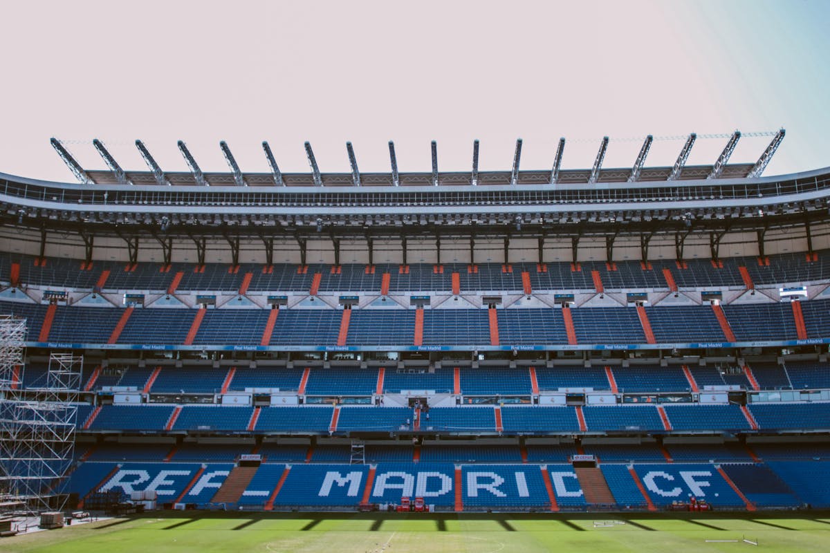 Empty stands of Santiago Bernabeu Stadium showing the blue and white Real Madrid seats