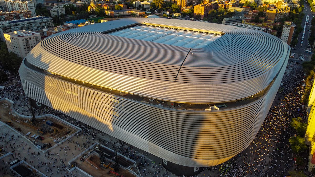 Santiago Bernabeu Stadium at sunset showcasing its modern architecture