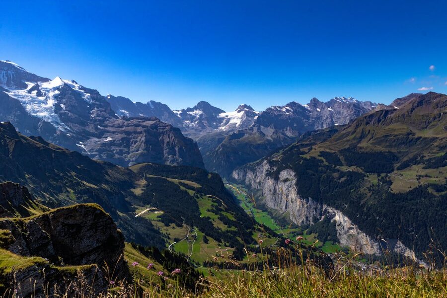Breathtaking mountain landscape in the Bernese Oberland with green valleys and Swiss Alps