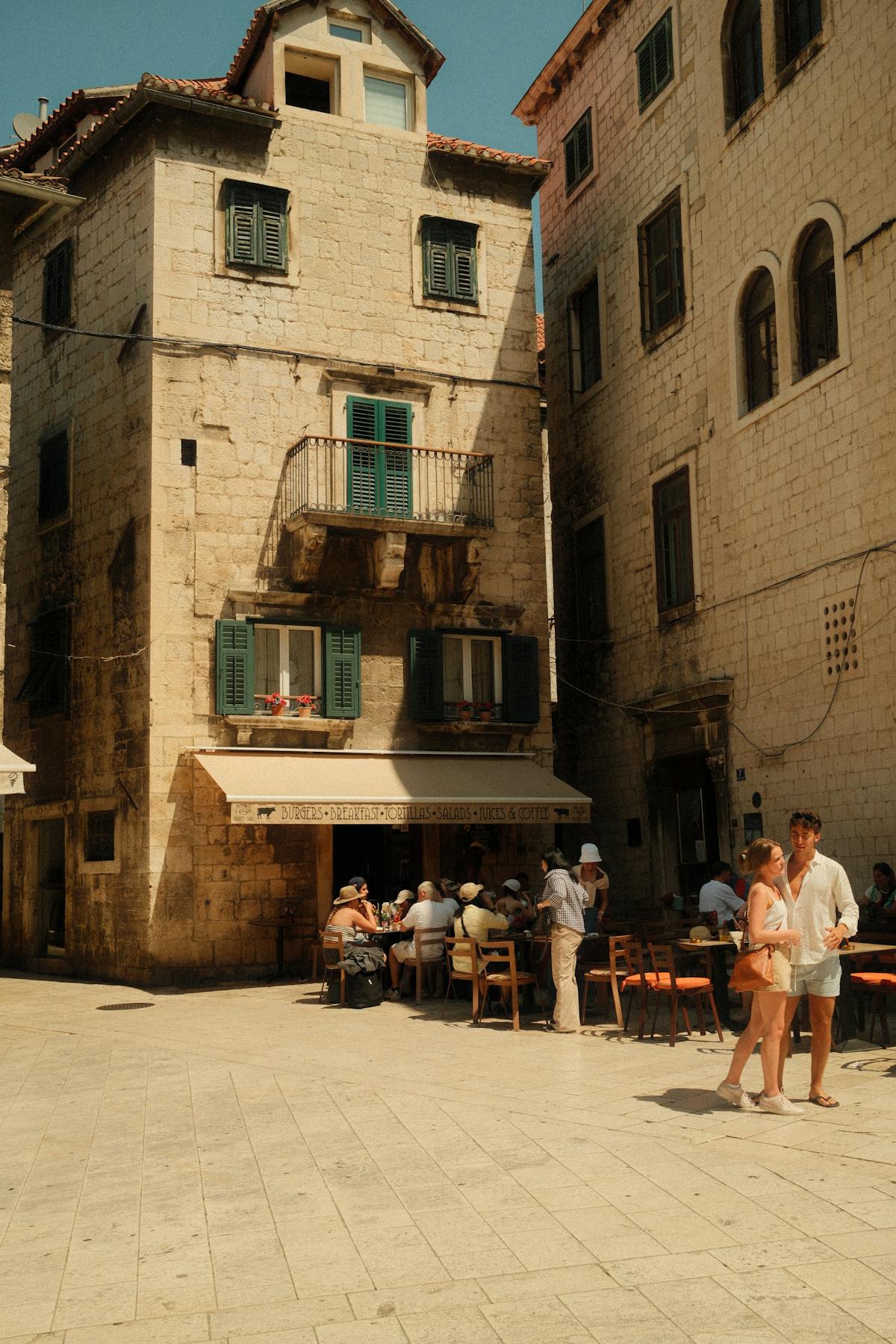 Historic street in Split Croatia bustling with tourists in summer