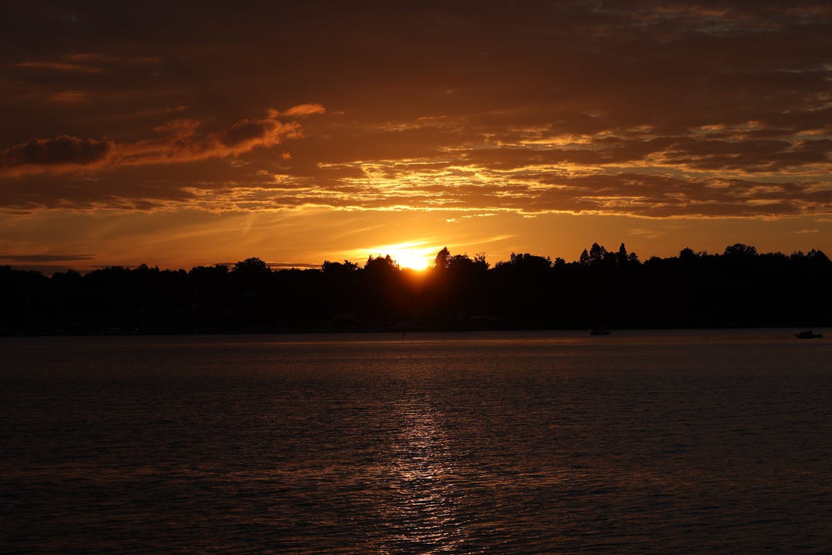 Sunset over a calm lake in Berlin with colorful reflections