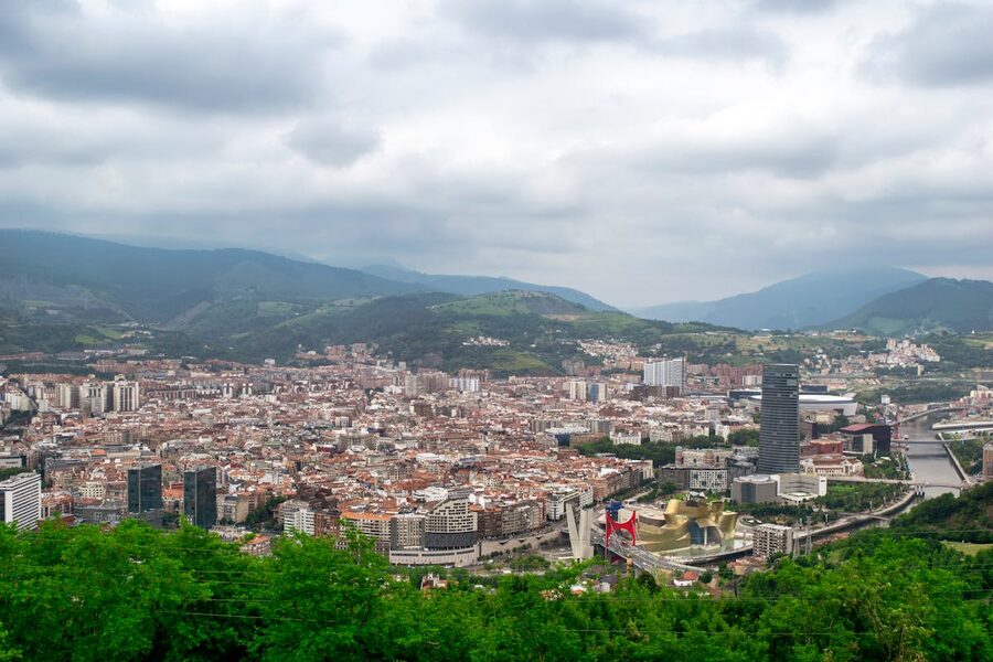 Aerial view looking down over Bilbao with the Guggenheim Museum and surrounding urban landscape
