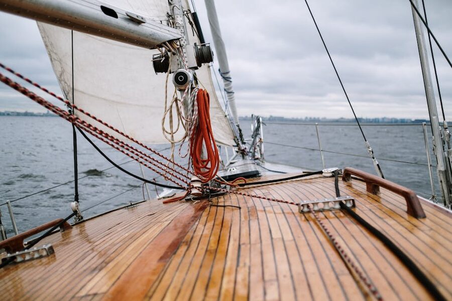 View from sailboat wooden deck on open sea