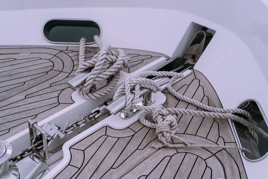 Knotted ropes and chains on boat deck