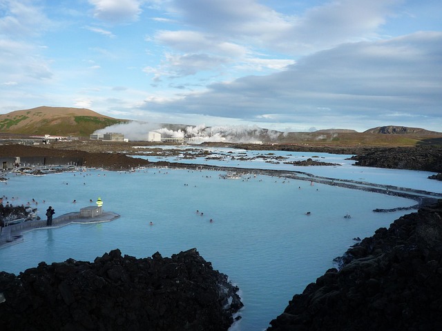 Person swimming in the milky turquoise waters of Iceland's Blue Lagoon