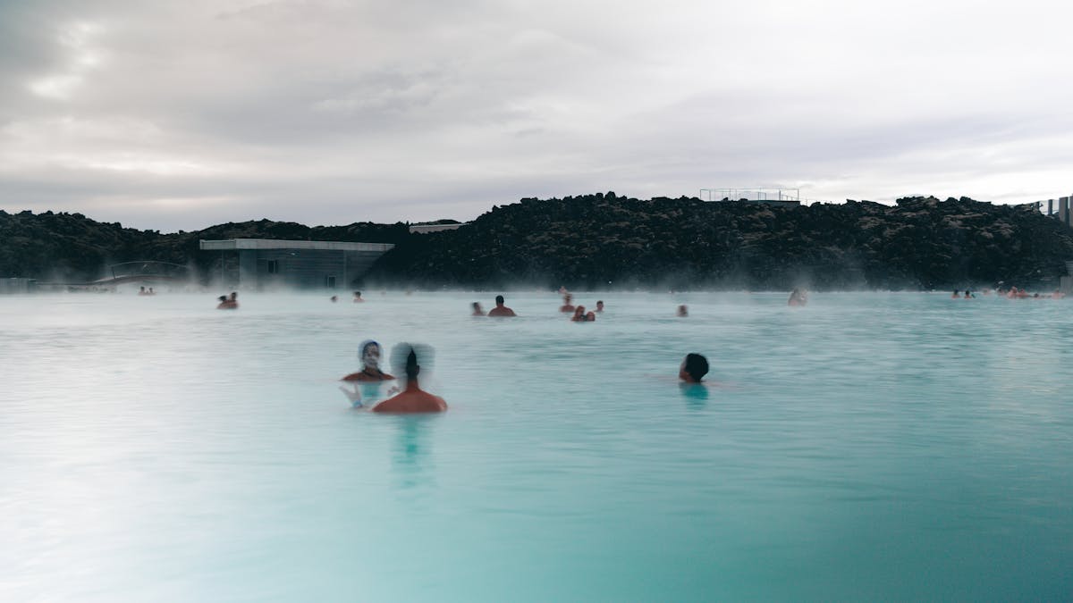 Visitors relaxing and bathing at the Blue Lagoon geothermal spa