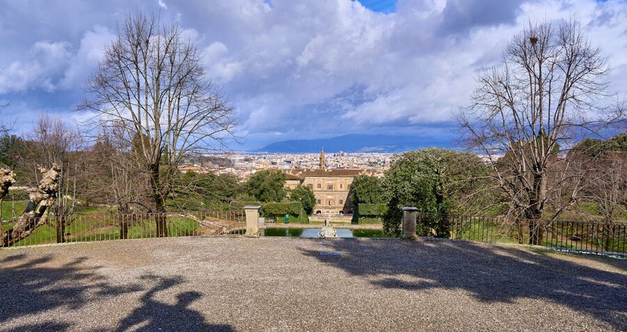Scenic view of Boboli Gardens in Florence on a clear spring day with wide pathways and manicured hedges