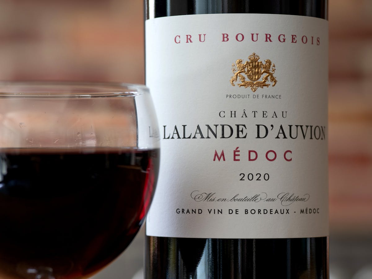 Chateau Lalande D'Auvion Medoc wine and glass close-up