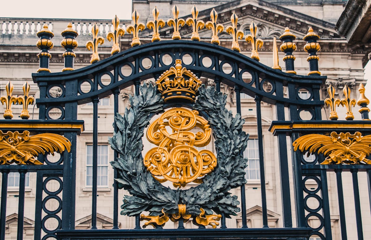 Detailed view of the gold-topped iron gates at Buckingham Palace entrance