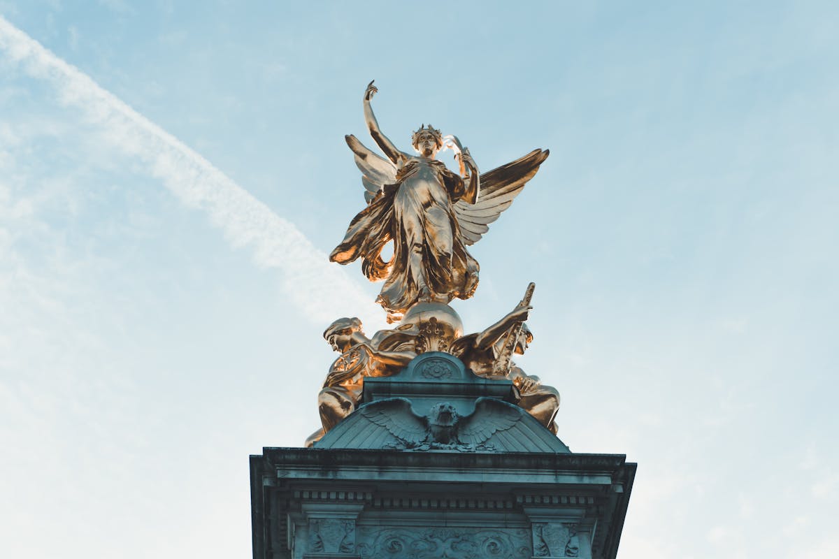 Gold Winged Victory statue on top of the Victoria Memorial near Buckingham Palace