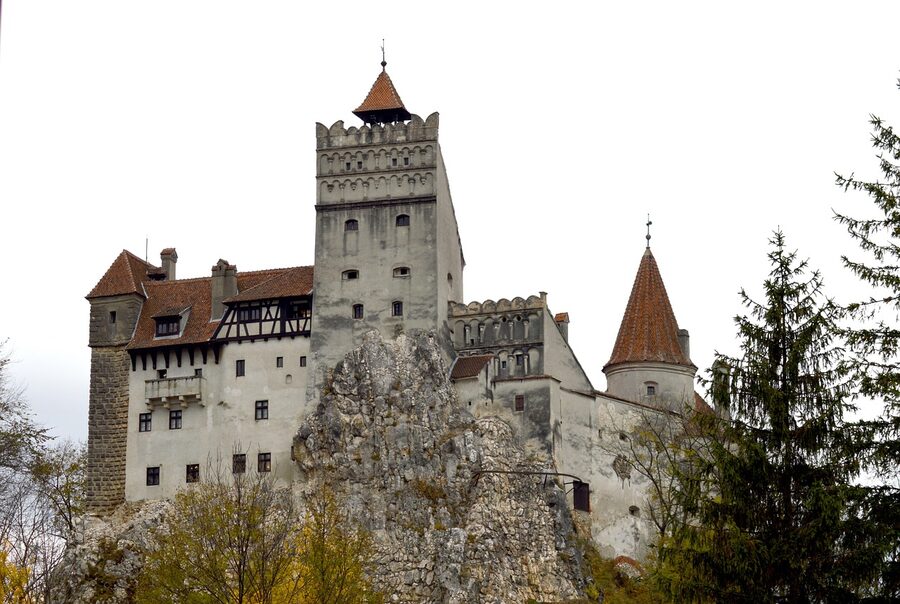 Bran Castle fortress in autumn with tower and landscape