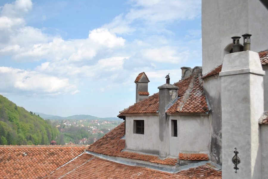 Bran Castle rooftop view overlooking mountain landscape