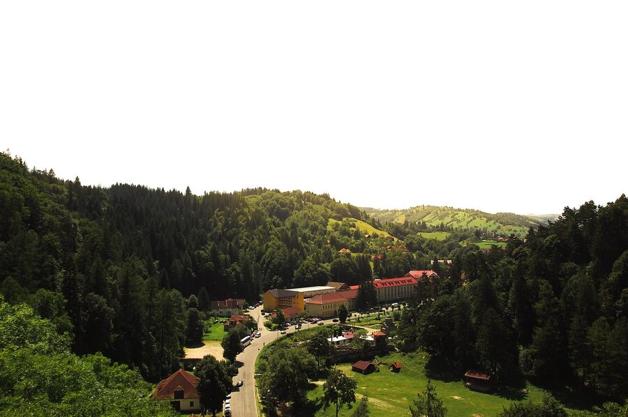 Valley view from Bran area in Transylvania with forests and sunbeams