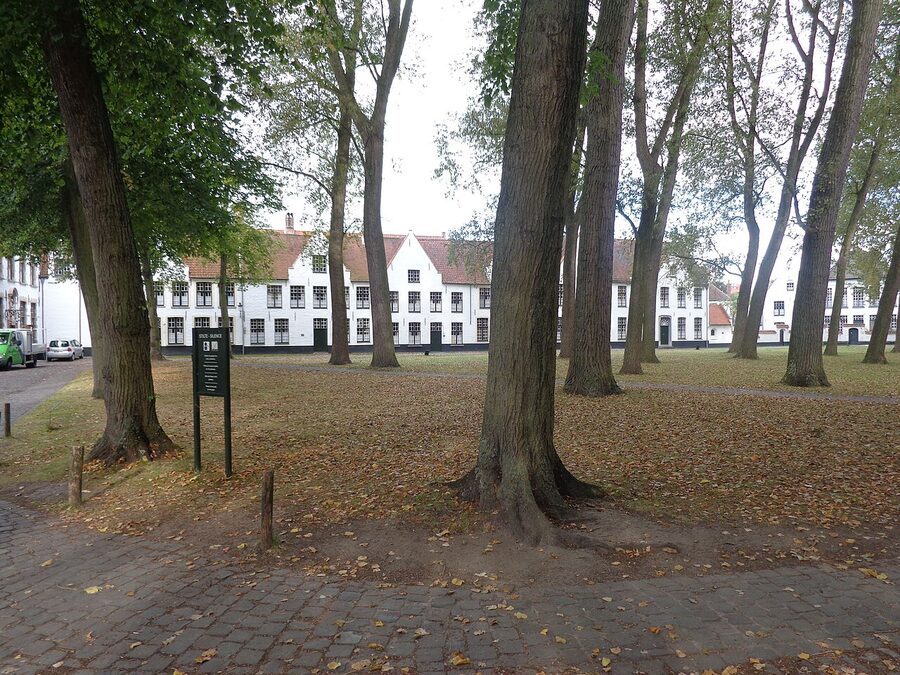 Beguinage courtyard in Bruges with white houses