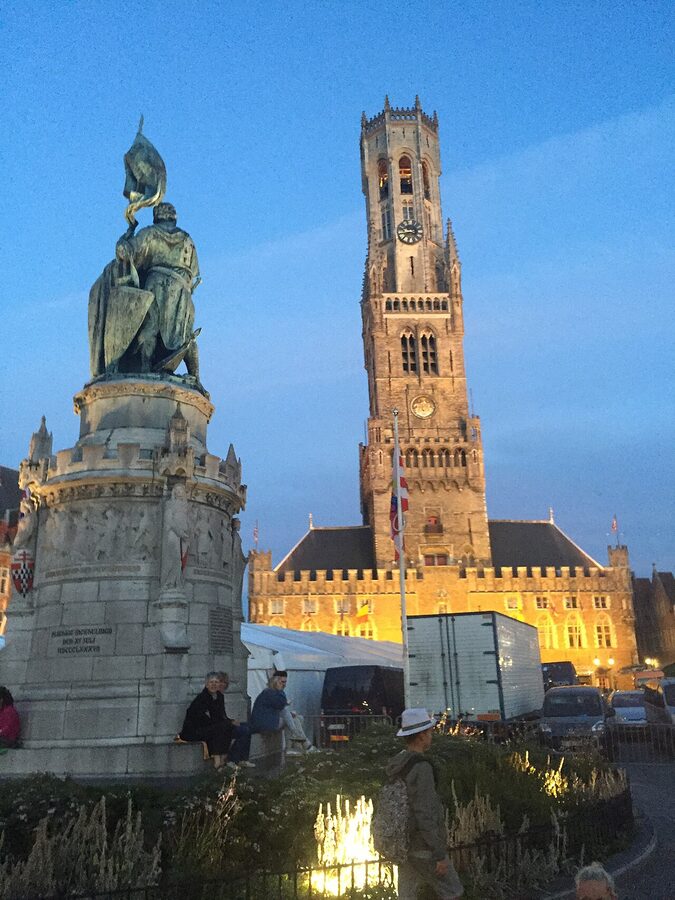 Markt square in Bruges with the Belfry tower and Breydel statue
