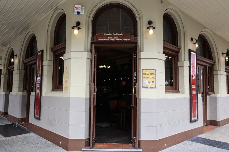 Belgian corner pub entrance with classic arched doorway