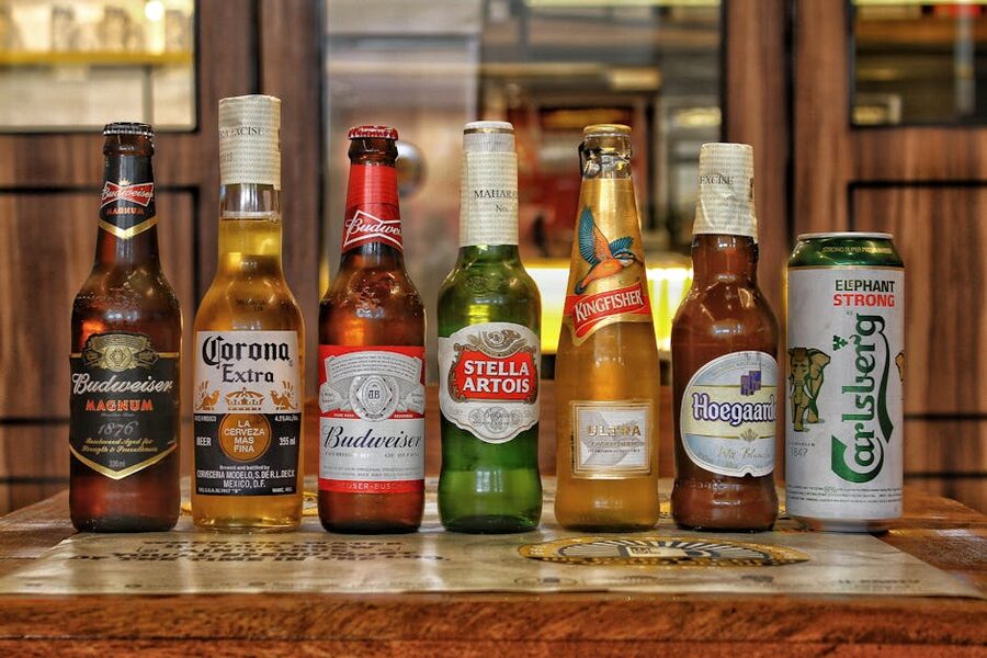 Collection of international beer bottles on a bar counter