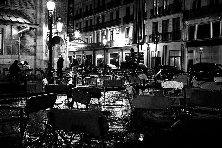 Saint-Gery Brussels at night in the rain with bar windows glowing
