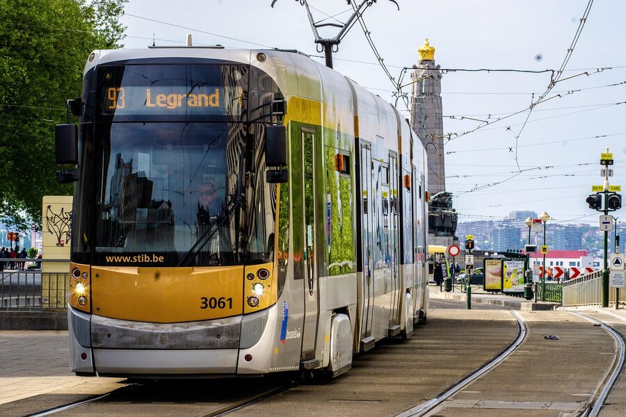 Brussels tram running through the city centre at evening