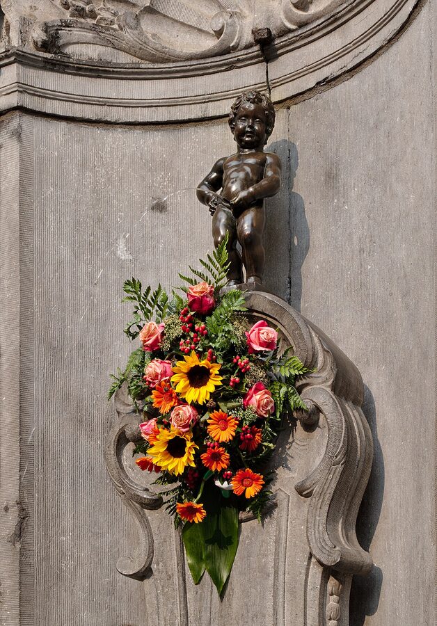Manneken Pis decorated with flower costume Brussels