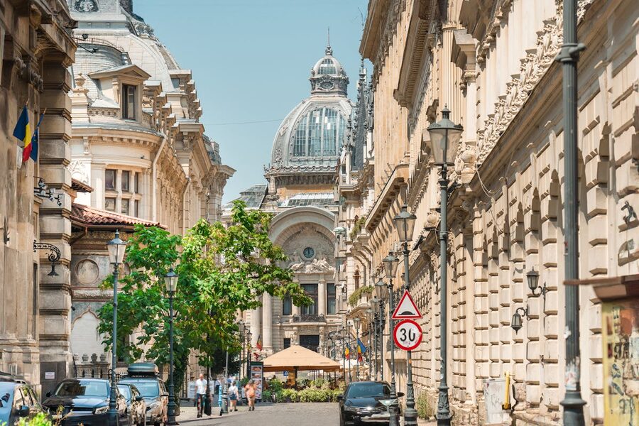 Historic street view in Bucharest with clock tower and European architecture