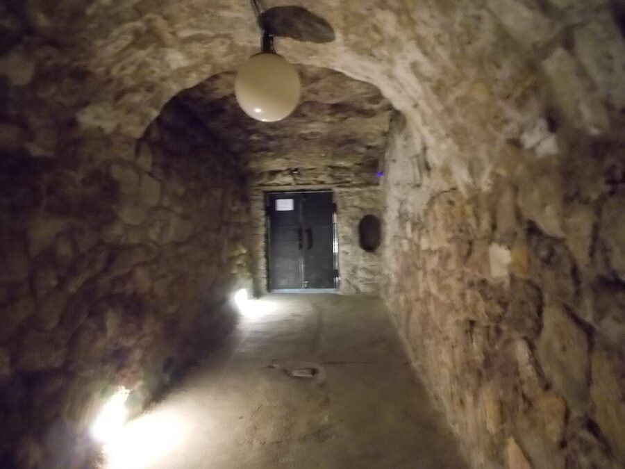 Inside the Buda Castle Labyrinth chamber lit with warm light