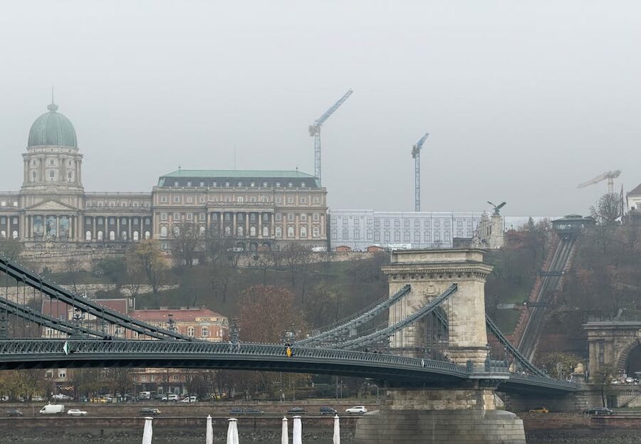 Buda Castle and Chain Bridge in misty Budapest