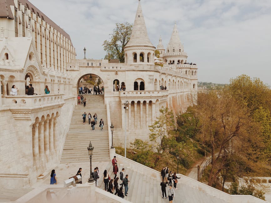 Tourists walking through the arches of Fishermans Bastion