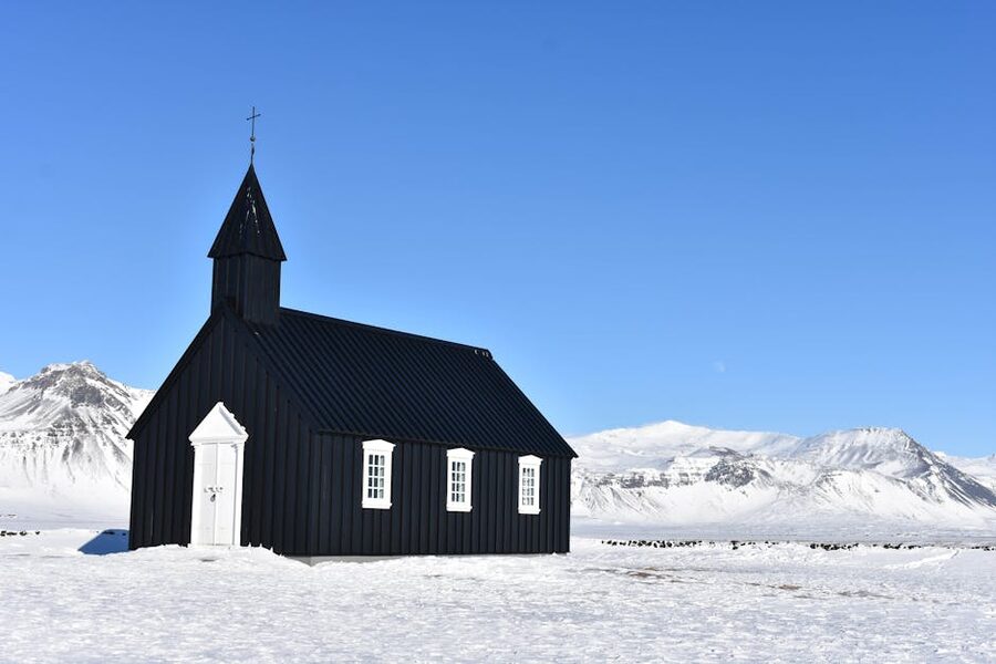 Búðakirkja black church in snow Iceland