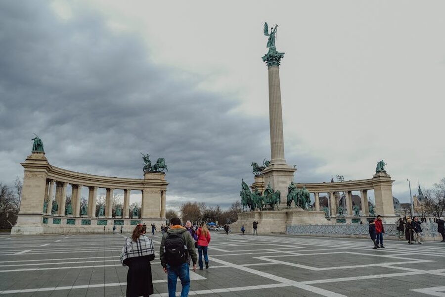 Heroes Square Budapest with statues and visitors