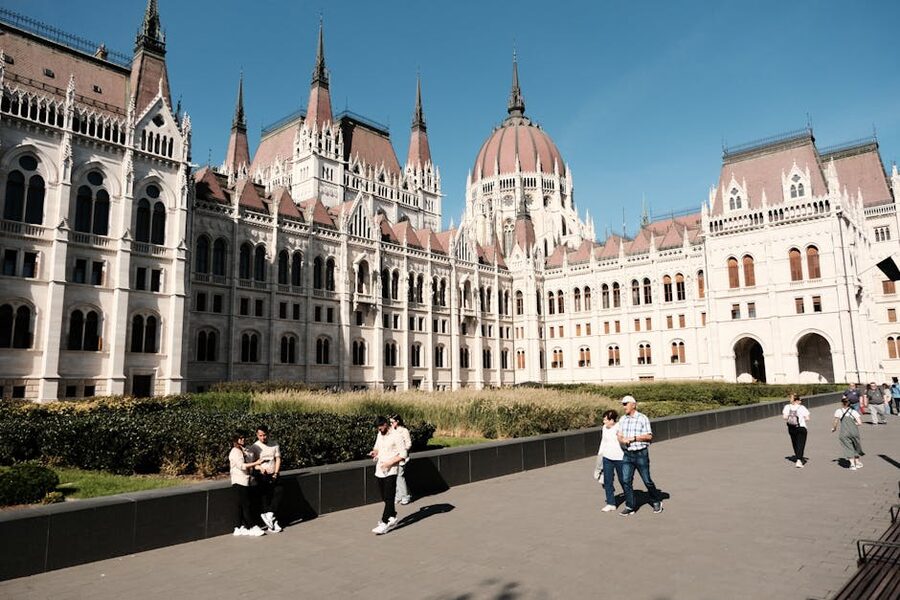 People walking in front of the Hungarian Parliament Budapest