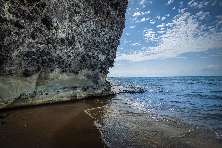 Cabo de Gata beach with cliffs and clear Mediterranean water