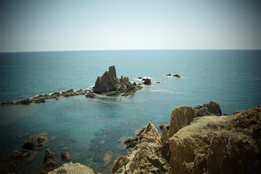 Reef and turquoise sea at Cabo de Gata with rocky outcrop